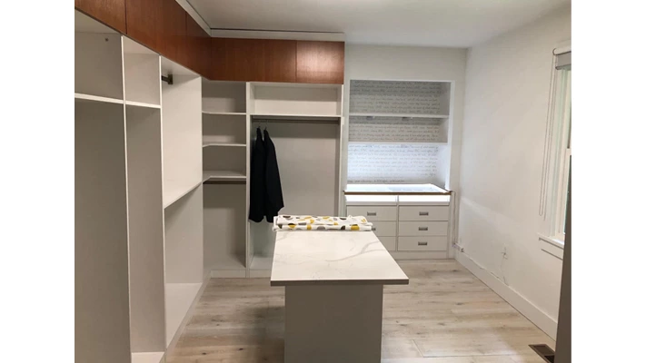 Installed custom closet and cabinet area in Eric New York house